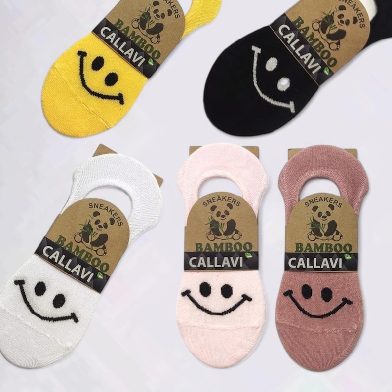 Five pairs of colorful bamboo no show socks with smiley faces in pink, mauve, yellow, white, and black, displayed on a white background.