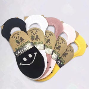 Five pairs of colorful bamboo socks with a smiley design on the black pair, labeled "Sneakers Bamboo .