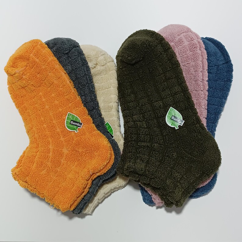 six colorful bamboo socks arranged in a fan shape on a white background.
