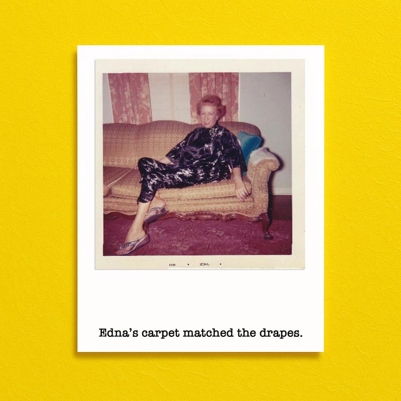 May include: Vintage Polaroid photo featuring a woman in a black and white floral print outfit, seated on a patterned sofa. The photo is framed with a white border and includes the text "Edna's carpet matched the drapes."