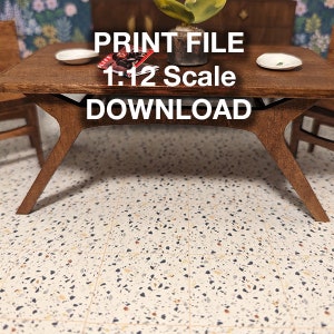 May include: A miniature wooden table with a brown finish and a 1:12 scale. The table has a rectangular top and four legs. The table is sitting on a terrazzo floor.