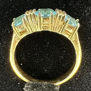 Aquamarine Costume dinner ring, gold tone band and mount Size 8