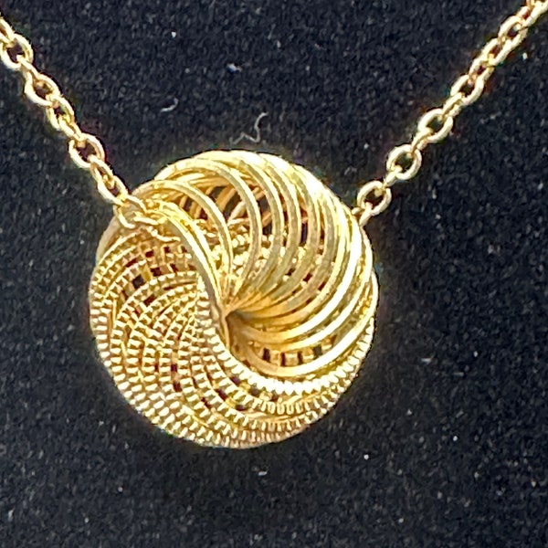 Gold Spiral Circle Pendant necklace, Beautiful detain in the faux gold piece.