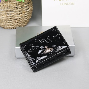 Cartera triple de cuero negro Vivienne Westwood con orbe dorado auténtico imagen 2