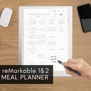 May include: A digital weekly meal plan displayed on a tablet, with a stylus in use. The tablet is on a wooden surface, accompanied by a white mouse, a cup of coffee, and a smartphone. The text on the image reads "reMarkable 1&2 PDF MEAL PLANNER".