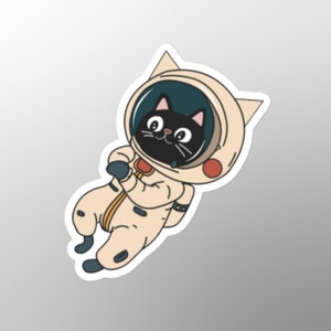 Adesivo divertente con gatto astronauta, giocoso, spazio, eccentrico, umoristico, viaggiatore spaziale divertente, sorridente, gatto nero, gattino, risatine, sciocchezze