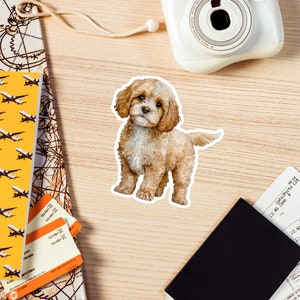 May include: A watercolor illustration of a brown and white puppy with a fluffy coat. The puppy is standing on all four paws and looking directly at the viewer.