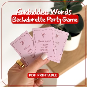 May include: A hand holds three pink cards from a "Forbidden Words Bachelorette Party Game." The cards have a bow graphic and words like "Corset," "Bride squad," and "Tie." The game title is in white and red text.