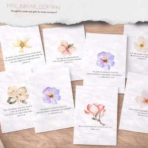 May include: A selection of white cards with watercolour floral designs and inspirational quotes. The cards feature various flowers in shades of pink, purple, and yellow. The text includes Bible verses and phrases like "Peace I leave with you."