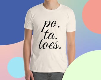 May include: White t-shirt with black text that reads "po. ta. toes."
