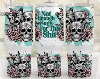 May include: White stainless steel tumbler with a teal and white background. The tumbler features a design of three black and white skulls with floral accents and butterflies. The text "Not Enough Sage For This Shit" is printed in teal on the tumbler.