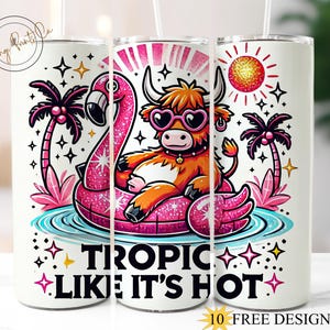 May include: A white tumbler with a pink flamingo and a brown and white highland cow on a tropical island. The tumbler has the text "Tropic Like It's Hot" printed on it.