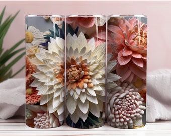 Op de afbeelding: Drie roestvrijstalen bekers met een bloemenontwerp. De bekers tonen een close-up van papieren bloemen in tinten wit, roze en perzik.