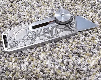 Utility blade laser engraved stainless steel holder. 1 per order.