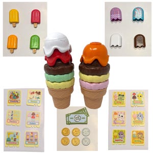 May include: A selection of toy ice cream cones, lollies, play money, and educational cards. The ice cream cones have layers of different coloured ice cream. The lollies are yellow, red, orange, and green.