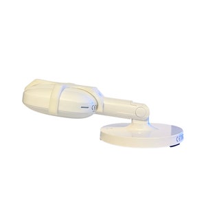 May include: White dental curing light with a flexible arm and a round base. The light has two LED bulbs and a CE marking.