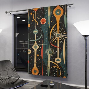 May include: A mid-century modern style tapestry featuring abstract shapes and colors on a dark background. The tapestry has a geometric design with circles, lines, and swirls in shades of blue, green, yellow, orange, and red.