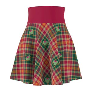 May include: A flared skirt featuring a plaid pattern in shades of red, green, yellow, and orange. The skirt has a wide, solid burgundy waistband and is adorned with green Mickey Mouse head shapes with pink bows.