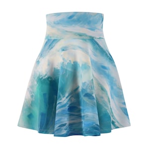 May include: A blue and white skater skirt with a watercolor-style print of waves.