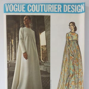 May include: A Vogue Couturier Design sewing pattern envelope for a floor-length gown by Fabiani, number 2537. The cover features a photograph of a solid white long-sleeved gown and an illustration of the same gown in a floral print fabric.