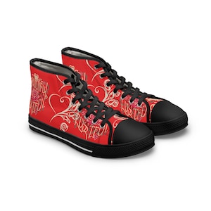 May include: A pair of red high-top canvas shoes with black laces and a black sole. The shoes have a floral pattern and the words "Beautifully Grateful" printed on them.