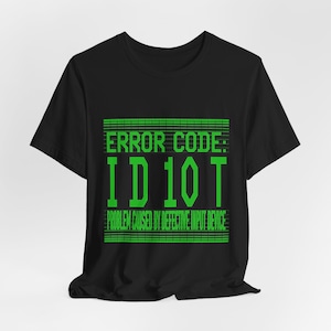 May include: Black t-shirt with a green graphic that says "ERROR CODE: ID10T" and "PROBLEM CAUSED BY DEFECTIVE INPUT DEVICE".
