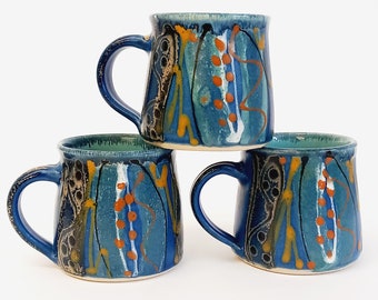 Unique handmade stoneware mug, perfect gift for coffee lovers. Deep midnight blue satin glaze exterior, fresh glossy turquoise inside.