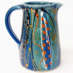 Unique handmade stoneware jug, around 15cm tall. Deep midnight blue satin glaze exterior, fresh glossy turquoise inside. Ideal gift. image 1