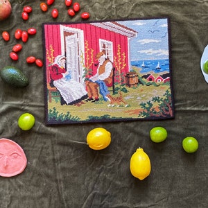 Vintage cross stitch with seaside scene | Swedish Embroidery with fisherman in Red, Blue and Green