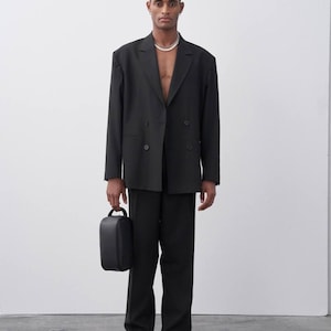 Elegant Black Double-Breasted Suit Set for Men - Wide Lapel Jacket & Matching Trousers with Layered Necklaces - Stylish Formal Outfit