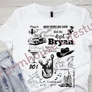 May include: A white t-shirt with a black design featuring a truck, a cowboy hat, a fishing hook, a deer, a margarita glass, musical notes, and the text "Play it again", "Most people are good", "Kick the dust up Bryan", "One Margarita", "Rain is a good thing", "Huntin & fishin lovin everyday", "Do I", "Country girl", and "Knockin' Boots".