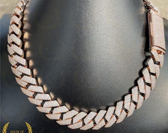 May include: A rose gold chain necklace with a prong-set diamond pattern. The chain is thick and has a box clasp.