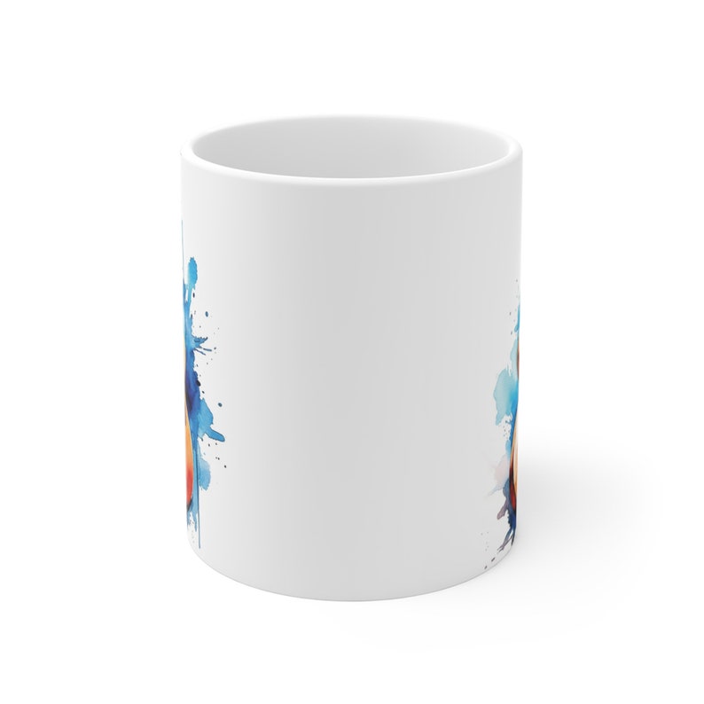 May include: White ceramic mug with a watercolor design of blue and orange splatters.