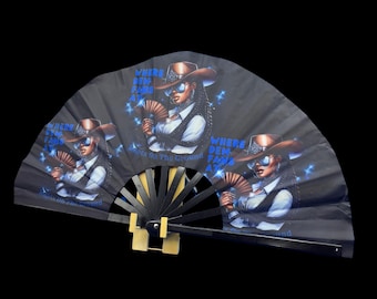 May include: Black hand fan with a repeating illustration of a woman in a cowboy hat and sunglasses, holding a fan. The text "Where Dem Fans At?" is printed on the fan in blue. The fan is open, displaying the design.