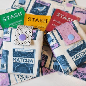 Cartera plegable para bolsitas de té (azul, rosa, morado y violeta) (con cierre a presión)