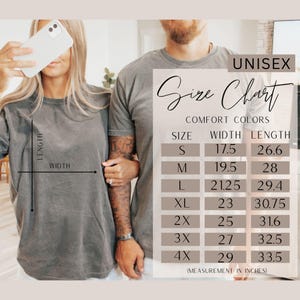 May include: Two people wearing gray unisex t-shirts. The image includes a size chart with measurements in inches for width and length, ranging from size S to 4X. The chart is labeled "Comfort Colors."