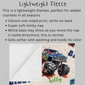 May include: A white fleece blanket with a colorful monster truck print on one side. The print features a blue, red, and green monster truck with the name "billy" written underneath. The back of the blanket is white.