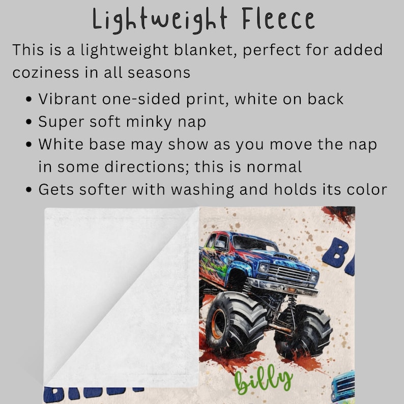 May include: A white fleece blanket with a colorful monster truck print on one side. The print features a blue, red, and green monster truck with the name "billy" written underneath. The back of the blanket is white.