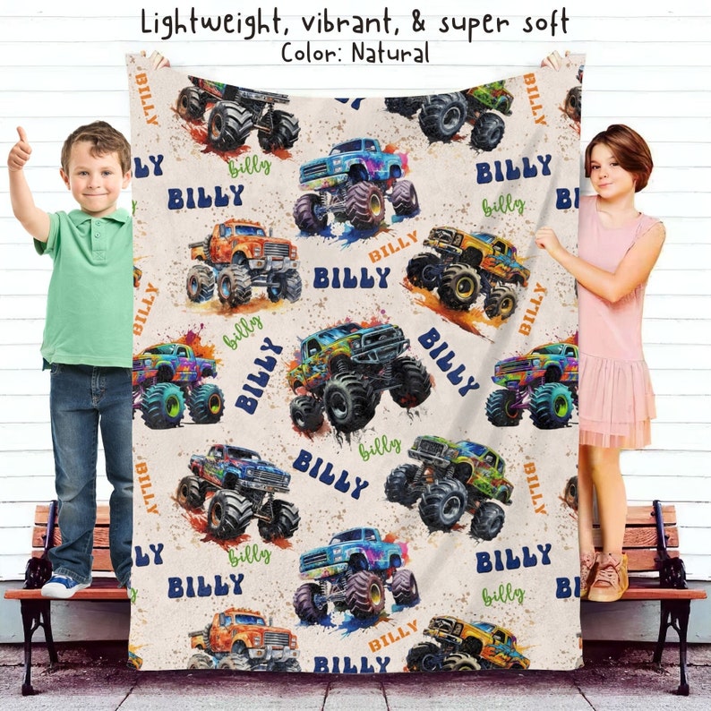 May include: A soft, beige fleece blanket with a repeating pattern of colorful monster trucks. The trucks are decorated with the name "Billy" and have a watercolor-like effect.