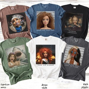 May include: Collection of six graphic t-shirts in various colors, including espresso moss, denim white, and black pepper. Each shirt features a unique image of a doll or a person with text. The text includes phrases like "great girl, huge bush" and "feral and engaged."