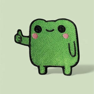 Toppa ricamata a forma di rana: disegno con pollice in su, termoadesiva/a strappo