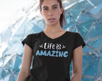 May include: A black v-neck t-shirt with the text "Life is" in white and "AMAZING" in blue.