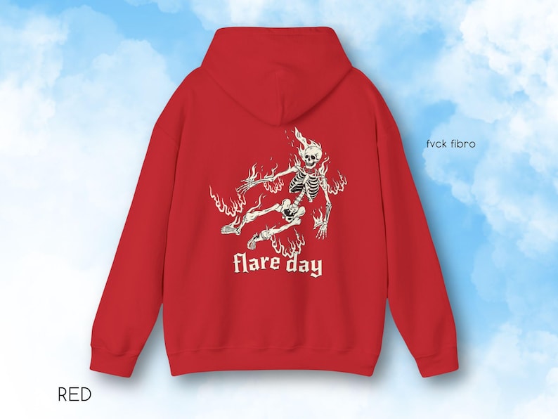 May include: Red hooded sweatshirt with a white graphic of a skeleton in flames and the text "flare day" printed on the front.