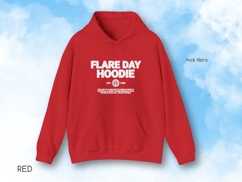 May include: A red hoodie with the text "FLARE DAY HOODIE" in white, along with additional text and a globe graphic. The hoodie has a front pocket and a drawstring hood. The word "RED" is at the bottom left.