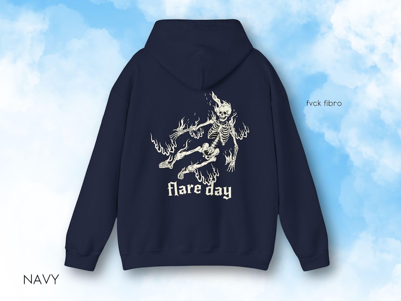 May include: Navy blue hooded sweatshirt with a white graphic of a skeleton in flames and the text "flare day".