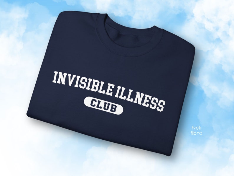 May include: A navy blue sweatshirt with white text that reads "Invisible Illness Club".