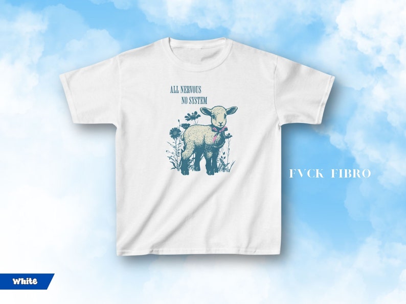 May include: White t-shirt featuring a lamb illustration with the text "ALL NERVOUS NO SYSTEM". The lamb is surrounded by flowers and wears a pink bow. The text "FVCK FIBRO" is printed on the right side of the shirt.