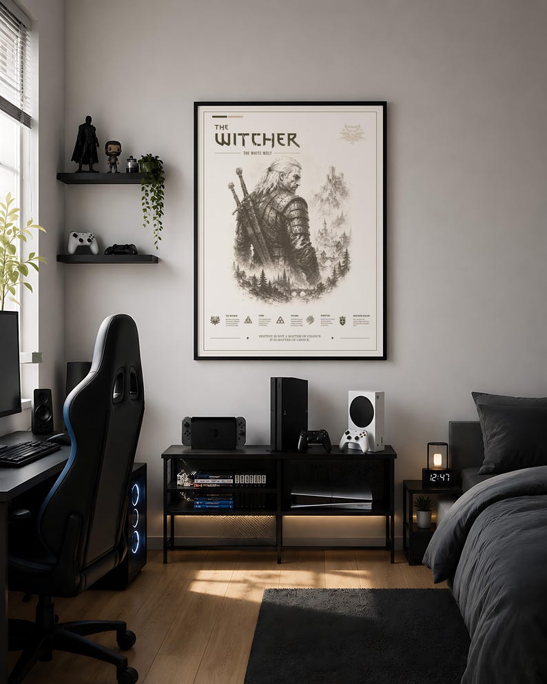 May include: A room featuring a framed "The Witcher" poster, a black gaming chair, and a black entertainment center with gaming consoles. The room has a modern aesthetic with a dark color scheme and a cozy atmosphere.
