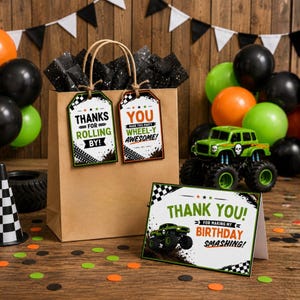 May include: A brown paper gift bag with black tissue paper, tags, and a greeting card. The tags read "Thanks for Rolling By!" and "You Made This Party Wheel-y Awesome!". A green monster truck and balloons are also present.