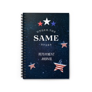 May include: A spiral bound journal with a navy blue cover featuring a starry night sky design. The cover has the text "Under the Same Stars" and "Deployment Journal" with red, white, and blue stars.